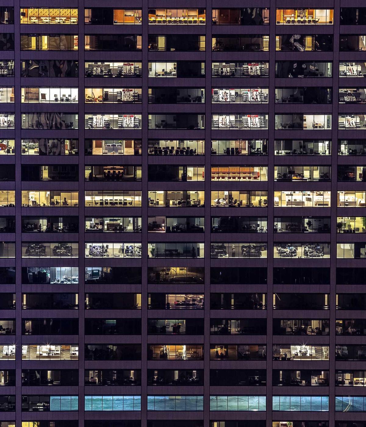 Office tower facade lit at night
